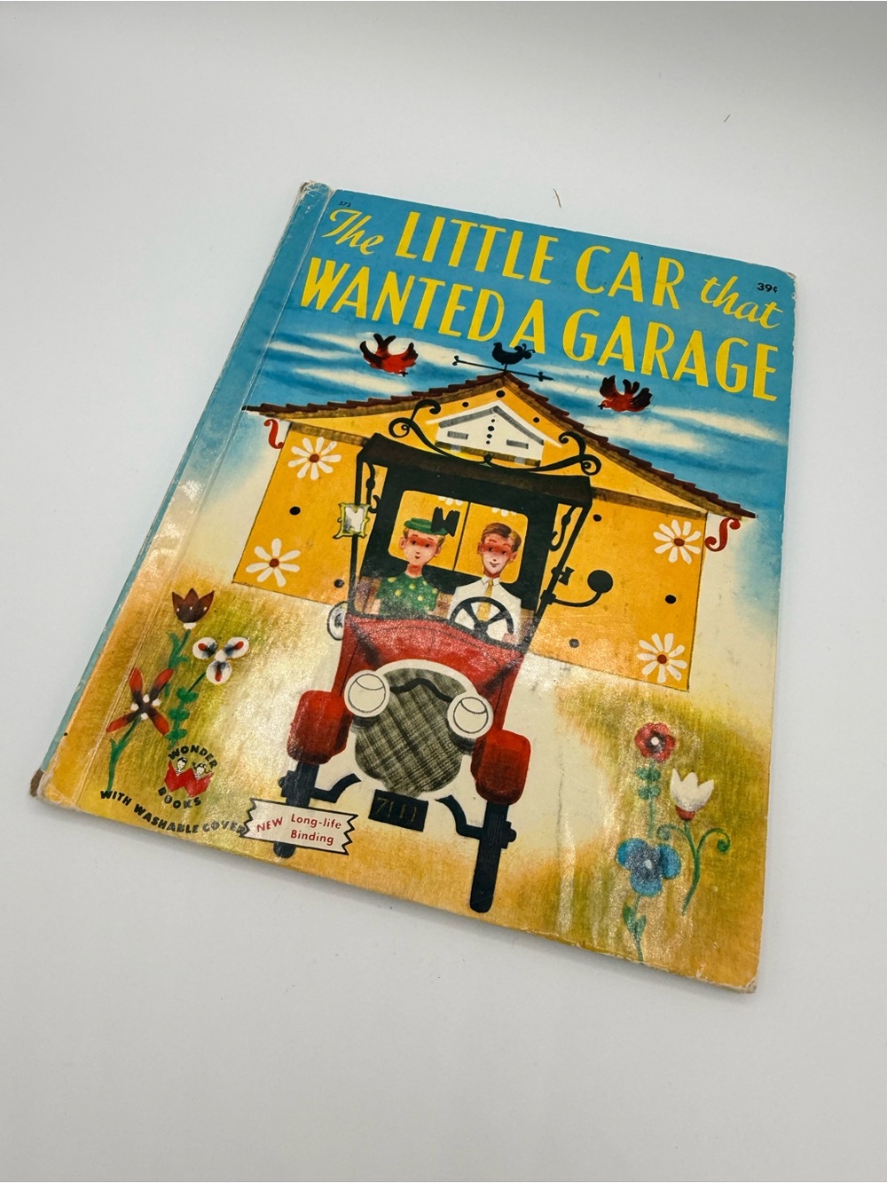 A vintage 1952 Wonder Book titled "The Little Car That Wanted A Garage."